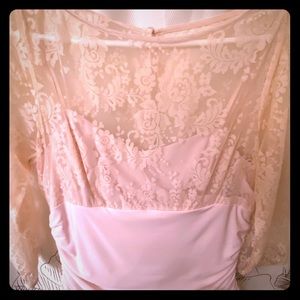 Pink Lace top dress falls a little below the knee.